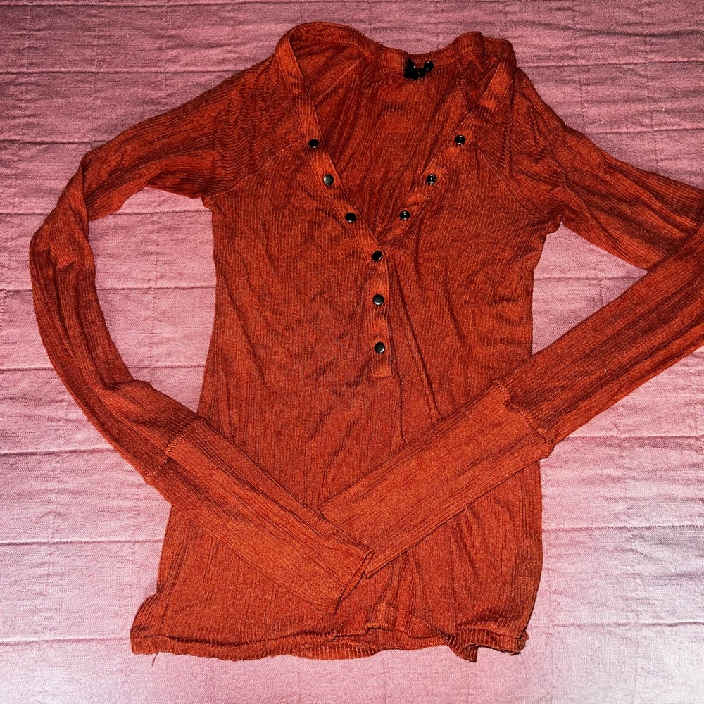 Out from under henley shirt